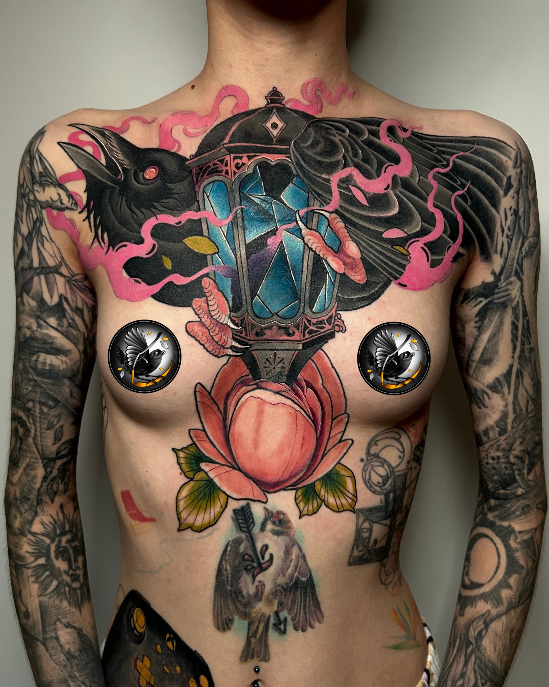 Showcase raven and glowing lantern chest piece by Vancouver tattoo artist Seth Zuiev